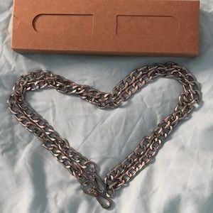 Silver hardware long strap.